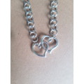 Chunky silver tone fashion necklace with 2 hearts entwined centre piece pendant & lobster clasp