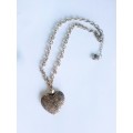 Silver tone fashion necklace with heart pendant  Short length necklace with extender chain & heart e