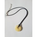 Black leather cord necklace with calcite gemstone pendant The necklace has an extender chain