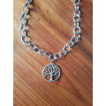 Chunky silver tone fashion necklace with the tree of life pendant and extender chain with heart char