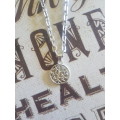 Silver tone fashion necklace with the tree of life pendant