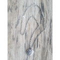 Silver tone fashion necklace with heart pendant