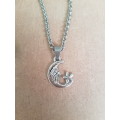 Silver tone fashion necklace with moon & star pendant Shorter length necklace with extender chain
