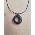 Black waxed cord / faux leather necklace with unusual round pendant The necklace has an extender cha