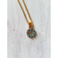 Delicate gold tone fashion necklace with cute blue flower pendant