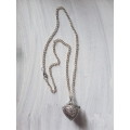 Silver tone fashion necklace with stunning heart locket pendant with rose quartz gemstone inside