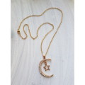 Delicate gold tone fashion necklace with moon & star clear rhinestone alloy metal pendant