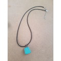 Black faux leather waxed cord necklace with imitation turquoise gemstone nugget pendant The necklace