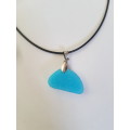 Black faux leather cord necklace with turquoise glitter resin pendant The necklace has an extender c
