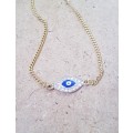 Gold tone fashion choker style necklace with traditional blue evil eye cubic zirconia centre piece p