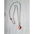 Silver tone fashion necklace with pink enamel butterfly pendant
