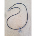 Black faux leather waxed cord with lotus flower pendant The lotus flower symbolizes purity, strength