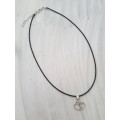 Black faux leather waxed cord necklace with 2 entwined hearts pendant The necklace has an extender c