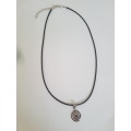 Black faux leather waxed cord necklace with stainless steel spiral pendant The necklace has an exten