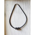 Black rubber cord necklace with simplistic design  The necklace ends & clasps are stainless steel