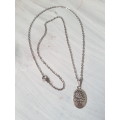 Silver tone fashion necklace with the tree of life oval pendant