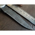Handmade Damascus steel folding knife with Resin handle scales.