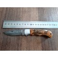 Handmade Damascus steel folding knife with wooden handle scales. OWL picture engraved. NEW STOCK !