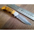 Handmade Damascus steel folding knife with wooden handle scales. OWL picture engraved. NEW STOCK !