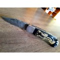 Handmade Damascus steel folding knife with Bull Horn Handle. Elephant picture engraved. NEW STOCK !