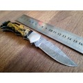 Handmade Damascus steel folding knife with Bull Horn Handle. Elephant picture engraved. NEW STOCK !