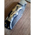 Handmade Damascus steel folding knife with Bull Horn Handle. Elephant picture engraved. NEW STOCK !