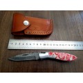 Handmade Damascus steel folding knife with Epoxy Resin handle scales.