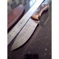 Handmade Damascus steel HUNTING  knife with Wooden handle scales.