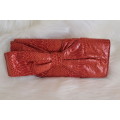 Orange Nine West Clutch with Faux Snakeskin and Bow Detail (Measures 12 x 26 cm)