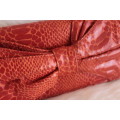 Orange Nine West Clutch with Faux Snakeskin and Bow Detail (Measures 12 x 26 cm)
