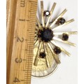 BROOCH-LARGE Sunburst dark Stone RED almost black Surrounded BY 8 smalll STONES- GOLD TONE METAL