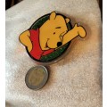 Poo Bear Pin back says  Disney Store St Lucia