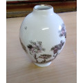 Small hand painted vase. Signed
