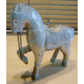Cladded horse figurine