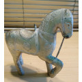 Cladded horse figurine