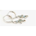 Sterling silver Huggie earrings with blue stones