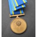 MINT "75 YEARS" COMMEMORATION MINIATURE MEDAL WITH RIBBON.