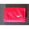 RED "NIKE" UNISEX WALLET WITH MULTIPLE POCKETS FOR CASH AND CARDS.