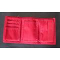 RED "NIKE" UNISEX WALLET WITH MULTIPLE POCKETS FOR CASH AND CARDS.