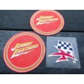 TWO JOHNNY LIGHTNING COASTERS AND A VINTAGE UNUSED `SASOL` STICKER.