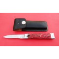 GENUINE STAINLESS STEEL SWITCHBLADE BY `FES` WITH LEATHER POUCH.