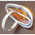 Silver ring with inclusions in Baltic Amber
