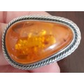 Silver ring with inclusions in Baltic Amber