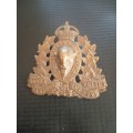 Royal Canadian Mounted Police cap badge. See description