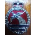 Royal Papua and New Guinea Constabulary enameled hat badge on wooden plaque - rare