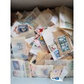Box of mixed used Rhodesia stamps