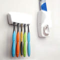 Toothpaste dispenser and toothbrush holder