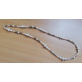 Pretty vintage beaded necklace with metal pieces between beads