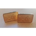 Pair of vintage gold-plated cufflinks with WR logo
