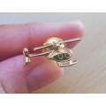 Pair of vintage gold-plated helicopter pin badges